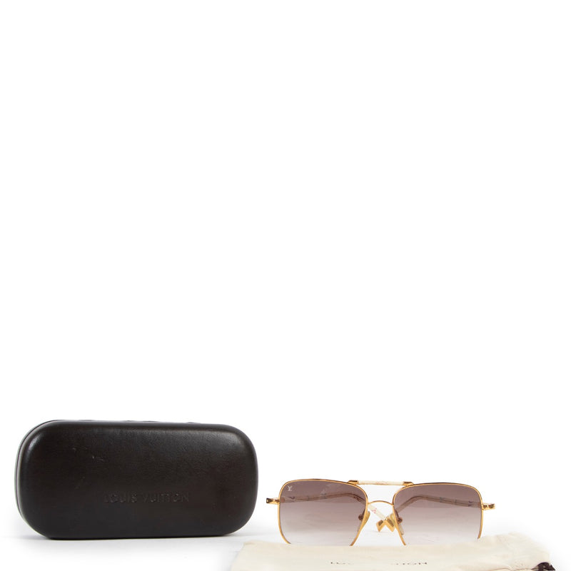 Buy online authentic second hand Louis Vuitton Murakami Monogram Metallic Sunglasses in very good condition at Labellov in Antwerp