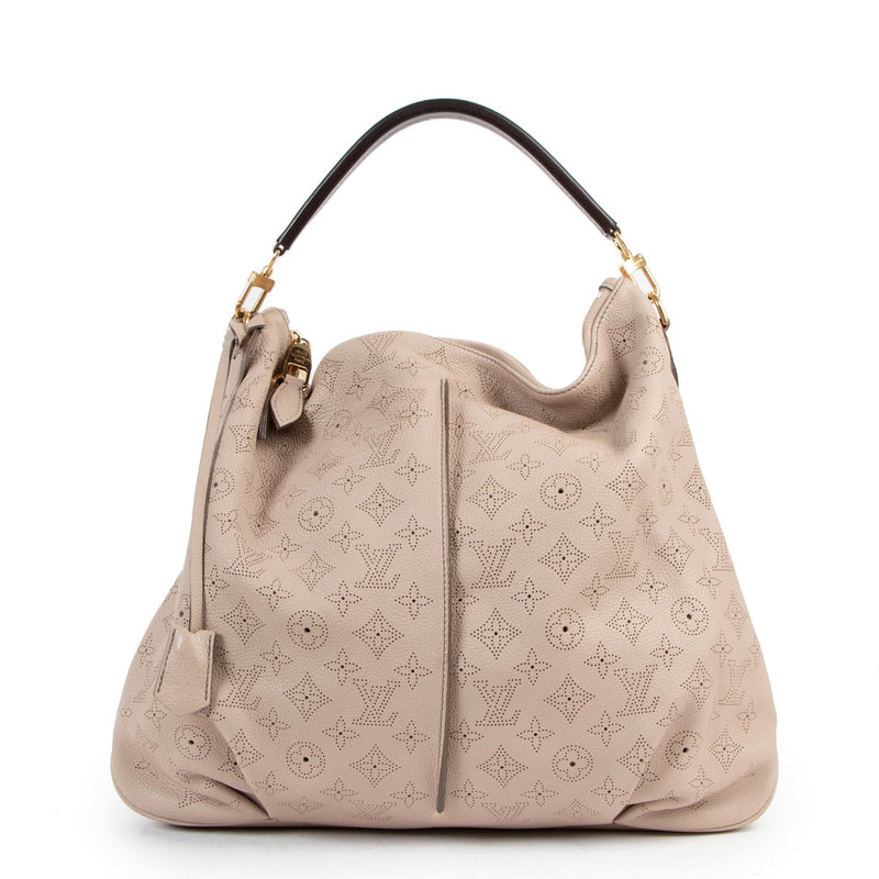 Buy online an authentic second hand Louis Vuitton pink Mahina Selene Perforated Monogram MM shoulder bag in good condition at Labellov in Antwerp.