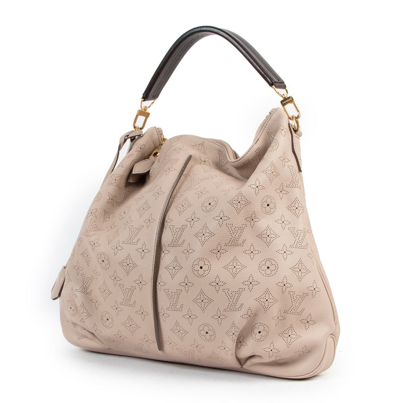 Buy online an authentic second hand Louis Vuitton pink Mahina Selene Perforated Monogram MM shoulder bag in good condition at Labellov in Antwerp.