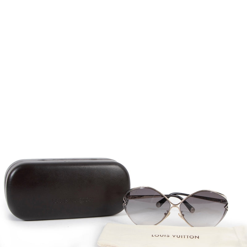 Shop now for your pre-loved, 100% authentic Louis Vuitton Silvertone Laurel Sunglasses at Labellov.
