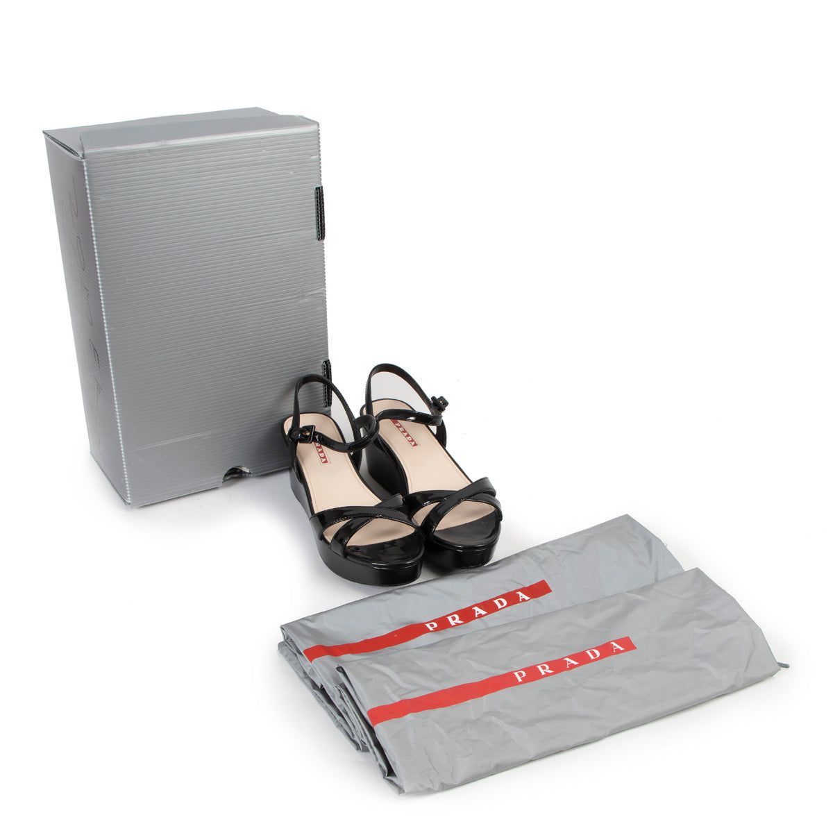 Prada Linea Rossa Black Patent Leather Wedge Sandals - Size 36 for the best price at Labellov secondhand luxury in Antwerp