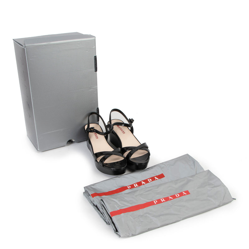 Prada Linea Rossa Black Patent Leather Wedge Sandals - Size 36 for the best price at Labellov secondhand luxury in Antwerp