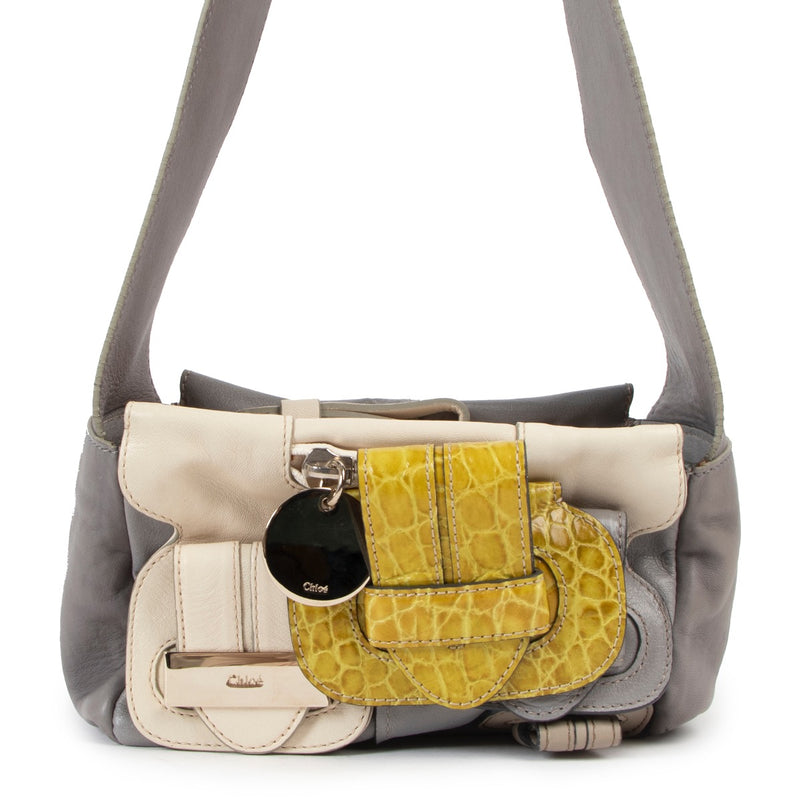 Shop now for your pre-loved, 100% authentic Chloé Grey Embossed Buckle Strap Shoulder bag at Labellov in Antwerp