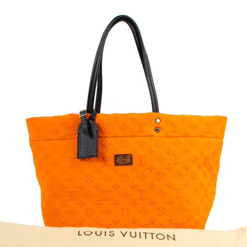 Buy online authentic second hand Louis Vuitton Limited Edition Orange Mono Neoprene Scuba MM Bag in very good condition at Labellov in Antwerp