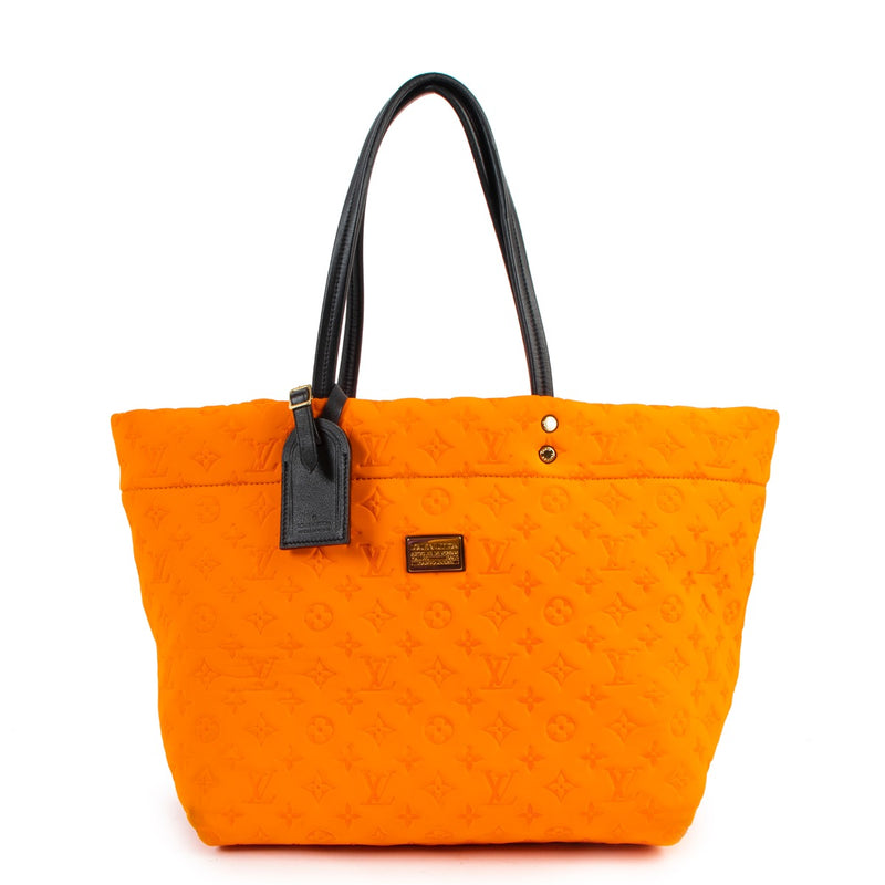 Buy online authentic second hand Louis Vuitton Limited Edition Orange Mono Neoprene Scuba MM Bag in very good condition at Labellov in Antwerp