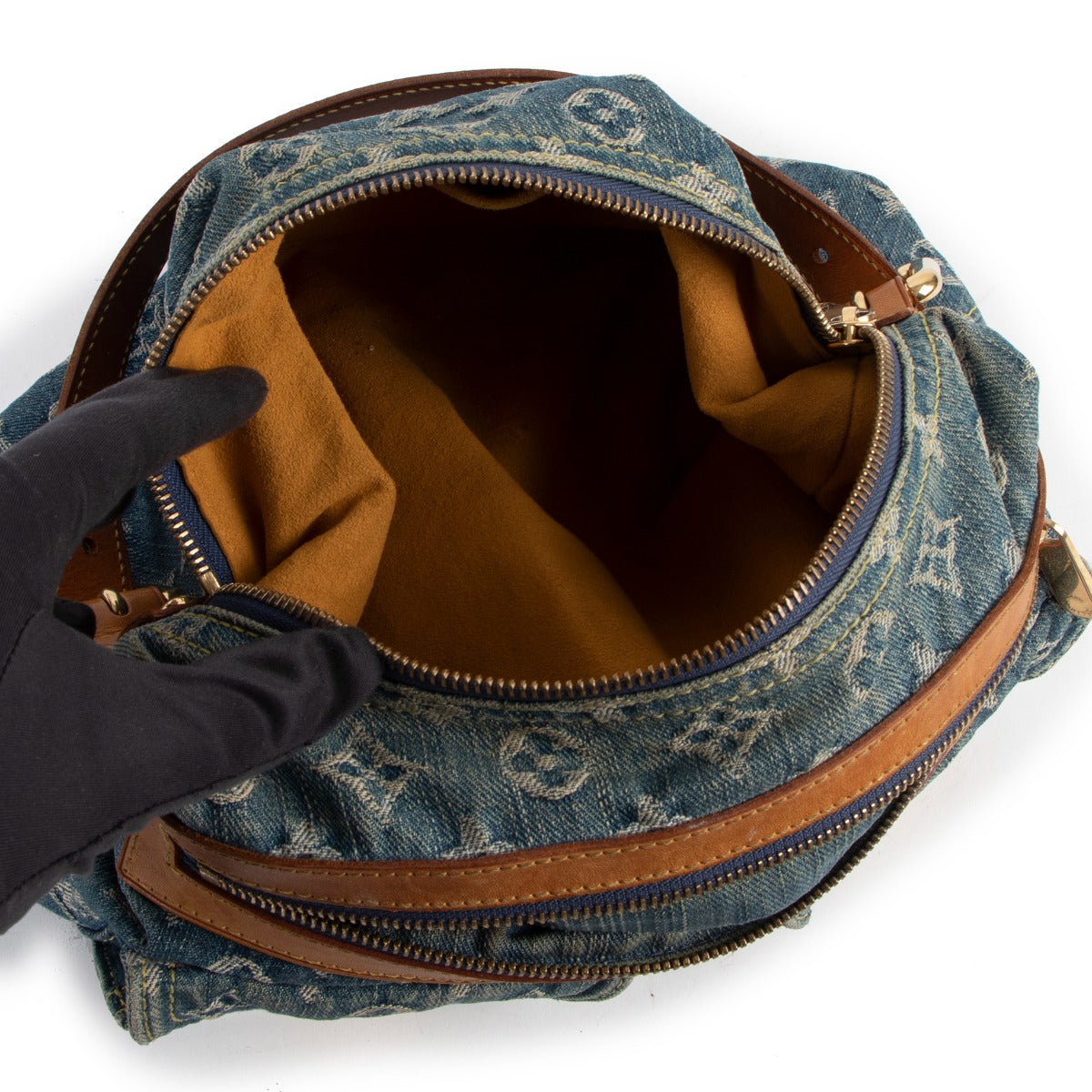 Buy online authentic second hand Louis Vuitton Blue Monogram Denim Baggy PM Bag in very good condition at Labellov in Antwerp