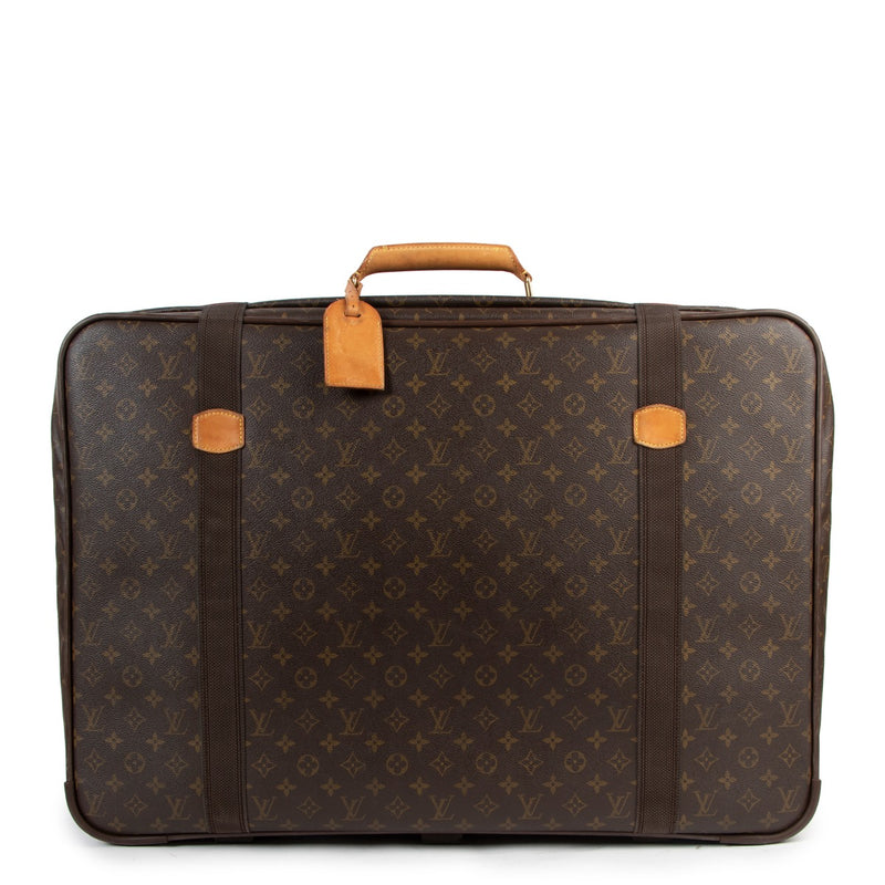 Buy online authentic second hand Louis Vuitton Satellite 70 Monogram Canvas Suitcase Travel Bag in very good condition at Labellov in Antwerp