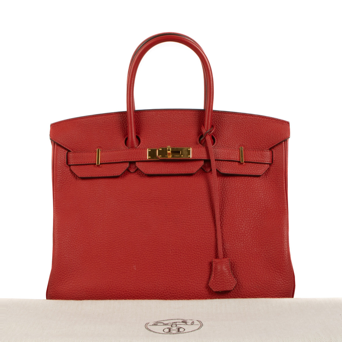 Explore luxury redefined with our Hermès Birkin 35 Rouge Casaque Togo GHW - a statement piece in a rich, timeless hue.