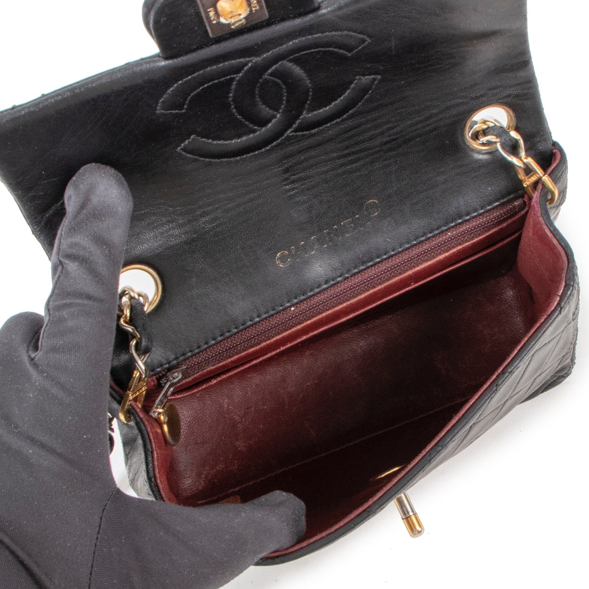 Buy an authentic second hand Chanel Black Lambskin Mini Square Classic Flap Bag GHW in good pre-loved condition at Labellov