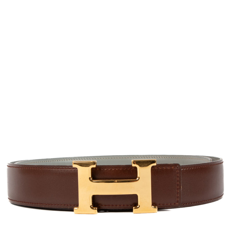 Bent u op zoek naar een authentieke designer Hermès Brown & Grey H Buckle Belt - size 90? Koop uw accessoires bij Labellov.