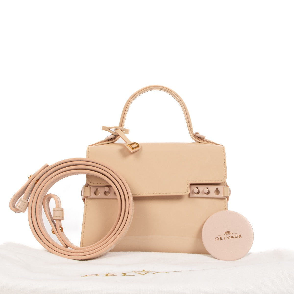 Buy an authentic second hand Delvaux Nude Patent Leather Tempête Micro Bag in new condition at Labellov.com