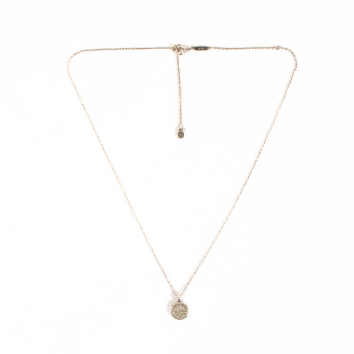 Shop safe online at Labellov in Antwerp, Brussels and Knokke this 100% authentic second hand Tiffany & Co Silver Rit Round DTag Pendant Necklace