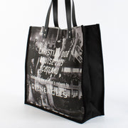 Christian Dior Cruise 2025 printed canvas tote bag with black leather handles at Labellov.com