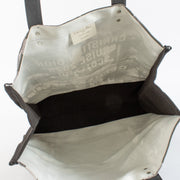 Christian Dior Cruise 2025 printed canvas tote bag with black leather handles at Labellov.com