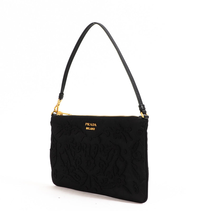 Buy an authentic second-hand Prada Black Nylon Tessuto Impuntu Nylon Pochette in very good condition at Labellov in Antwerp.