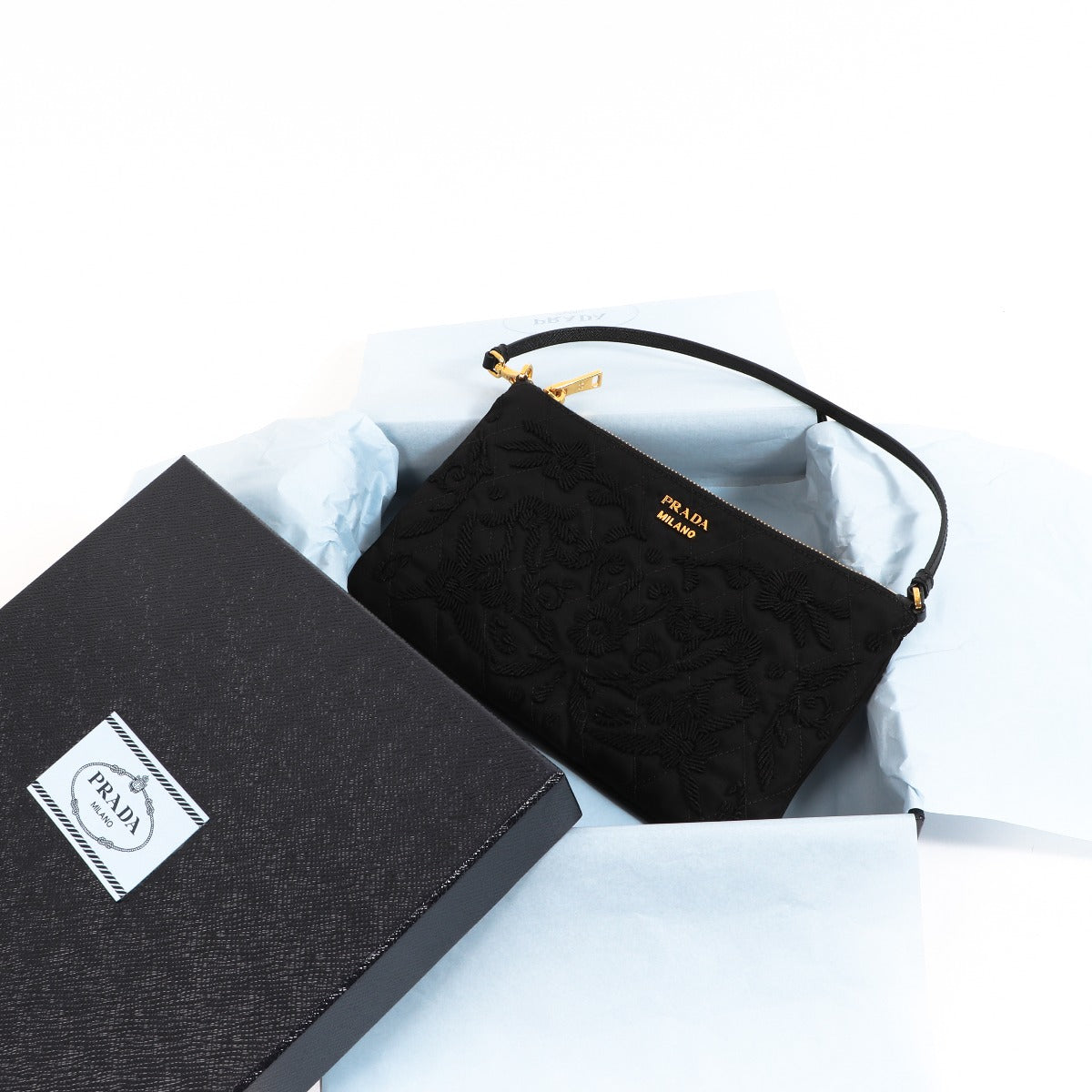 Buy an authentic second-hand Prada Black Nylon Tessuto Impuntu Nylon Pochette in very good condition at Labellov in Antwerp.