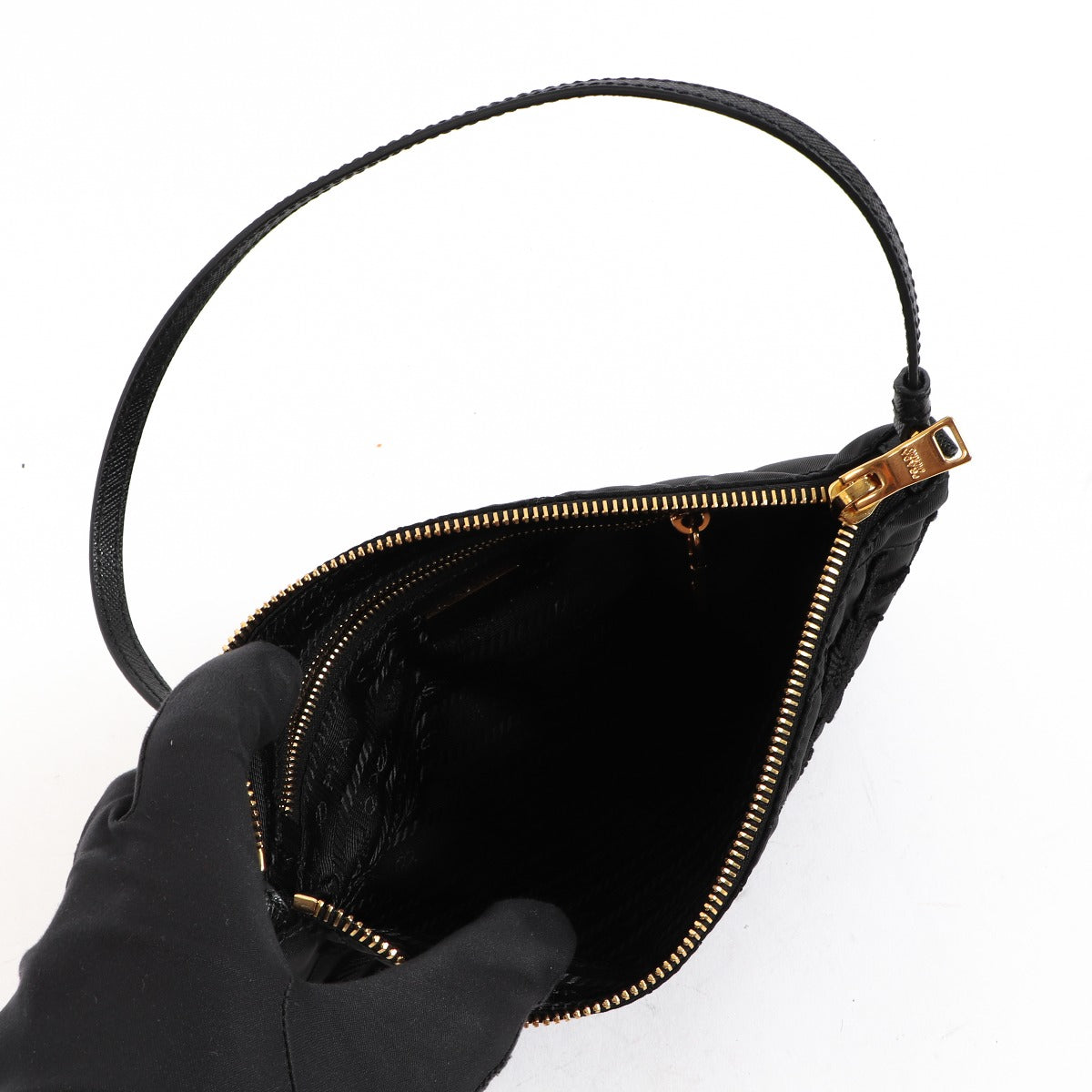 Buy an authentic second-hand Prada Black Nylon Tessuto Impuntu Nylon Pochette in very good condition at Labellov in Antwerp.