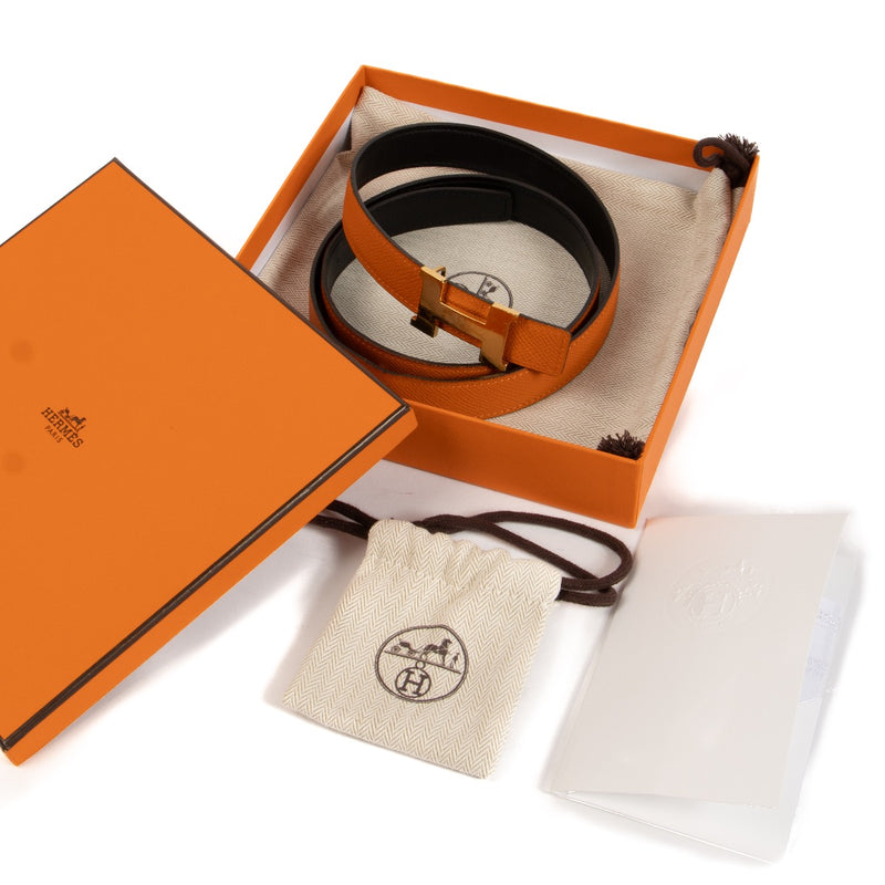 Shop safe online at Labellov in Antwerp, Brussels and Knokke this 100% authentic second hand Hermès Noir/Orange Swift/Epsom Mini Constance 24mm Belt - size 90