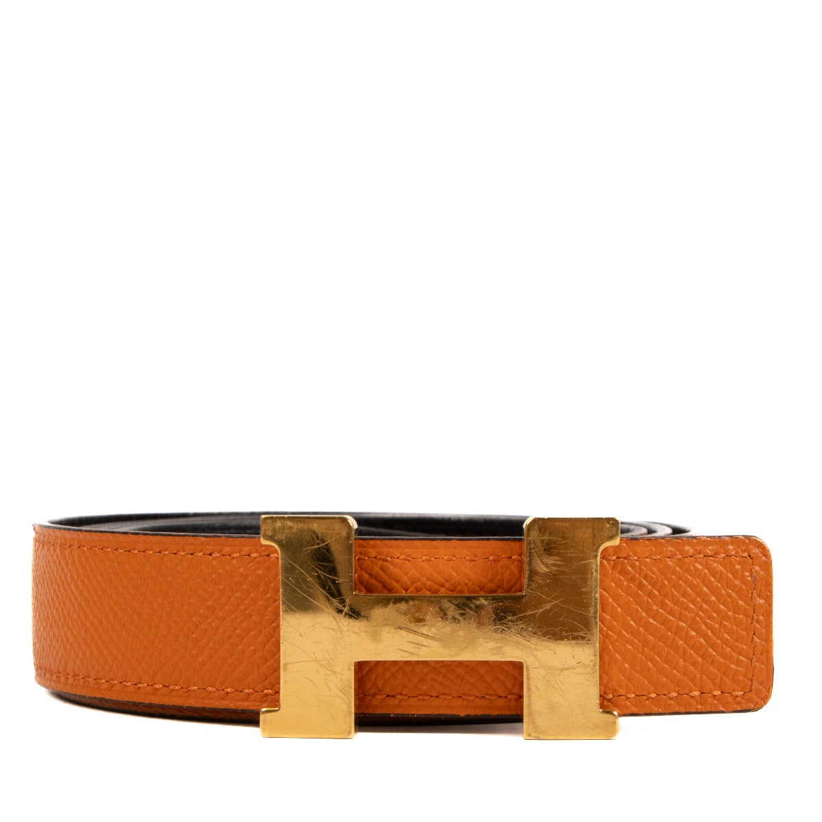 Shop safe online at Labellov in Antwerp, Brussels and Knokke this 100% authentic second hand Hermès Noir/Orange Swift/Epsom Mini Constance 24mm Belt - size 90