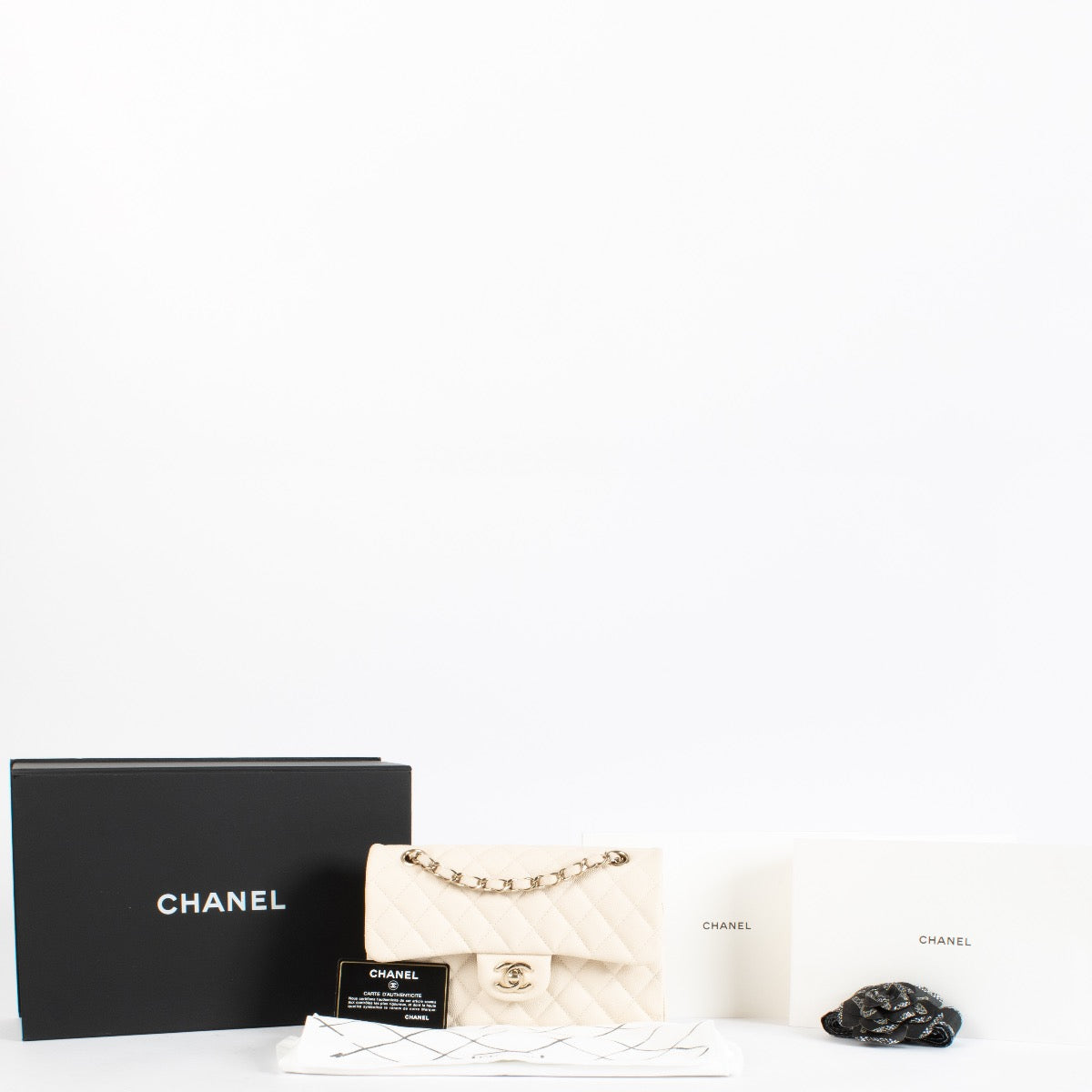 Authentic Second Hand Chanel Cream Caviar Small Classic Flap bag on Labellov.com