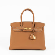 Authentic Hermès Birkin 30 Gold Togo GHW at www.labellov.com