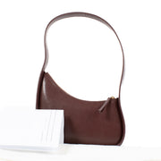 Shop safe online at Labellov in Antwerp, Brussels and Knokke this 100% authentic second hand The Row Raisin Shiny Kid Leather Half Moon Bag. Veilig online tweedehands authentieke The Row Raisin Shiny Kid Leather Half Moon handtas kopen bij Labellov.