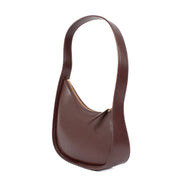 Shop safe online at Labellov in Antwerp, Brussels and Knokke this 100% authentic second hand The Row Raisin Shiny Kid Leather Half Moon Bag. Veilig online tweedehands authentieke The Row Raisin Shiny Kid Leather Half Moon handtas kopen bij Labellov.
