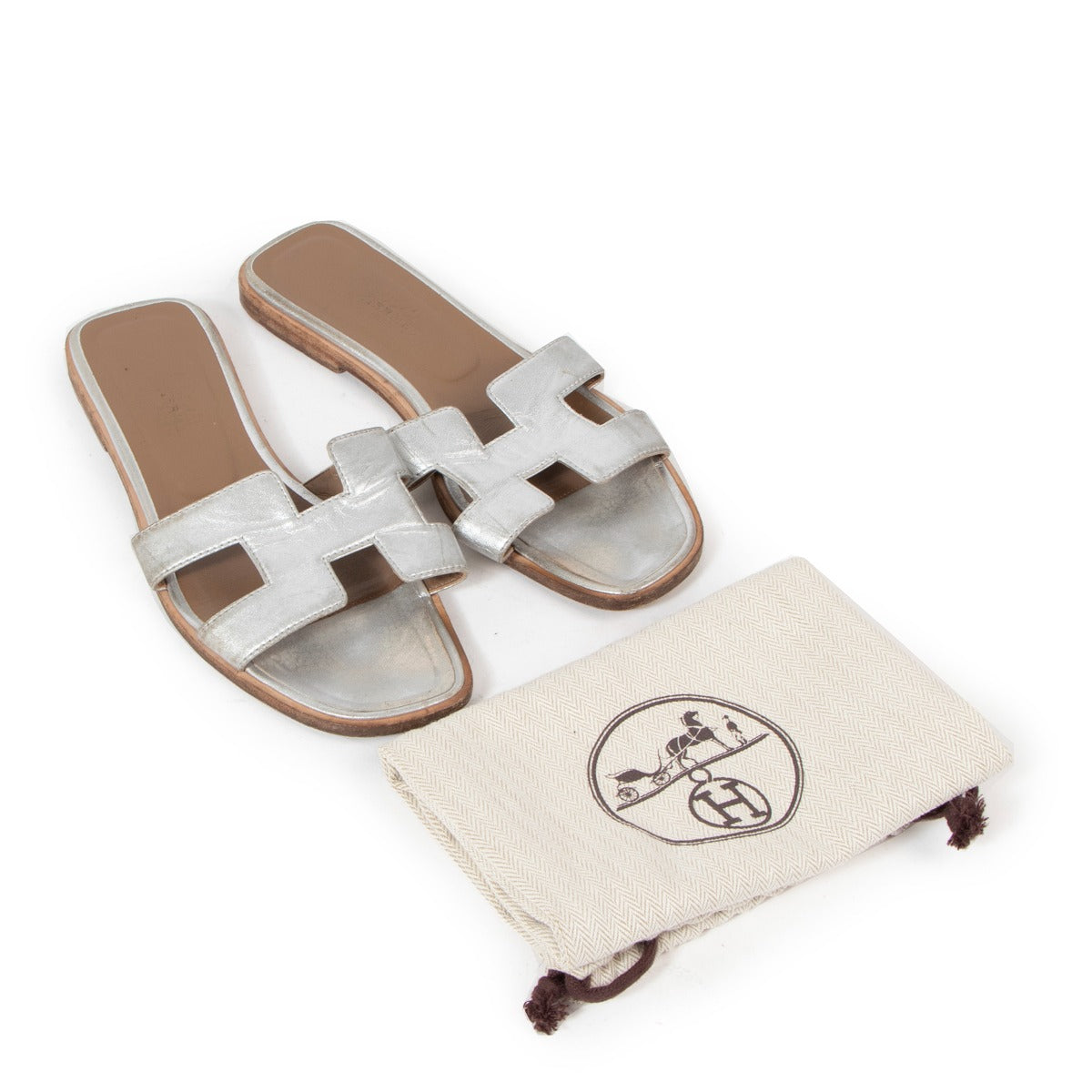 Buy verified second-hand Hermès Silver Leather Oran Sandals in good condition at LabelLov Antwerp