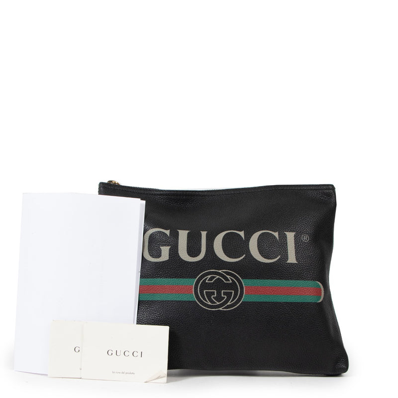 Buy an authentic second Gucci Black Print Leather Clutch in very good condition at Labellov