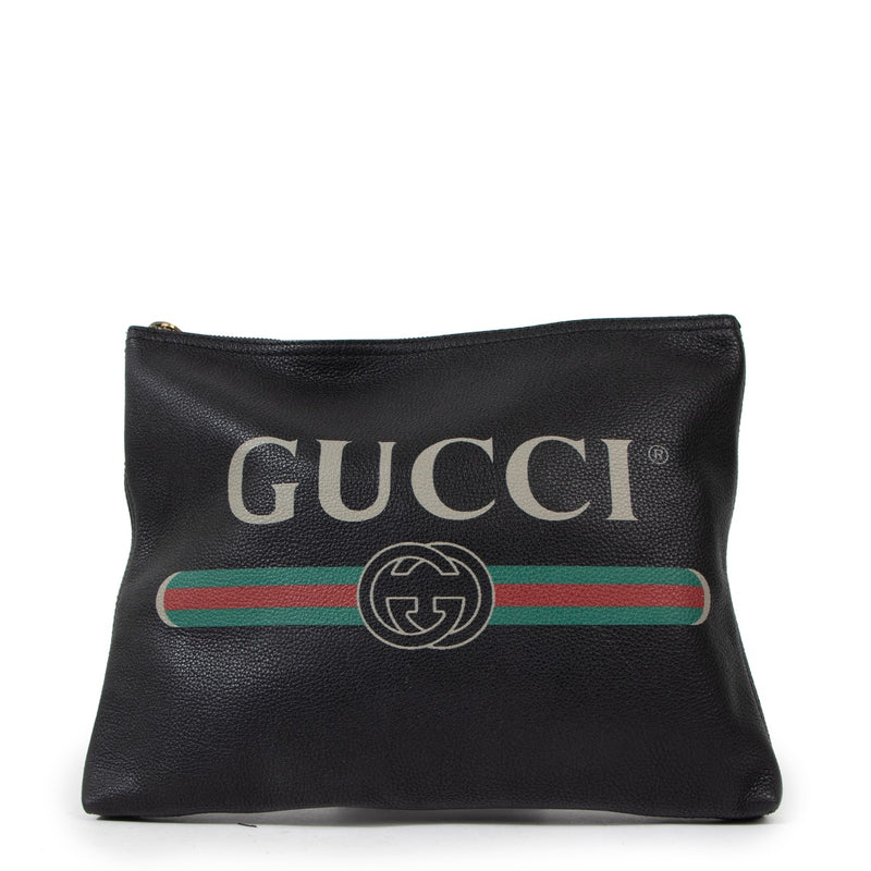 Buy an authentic second Gucci Black Print Leather Clutch in very good condition at Labellov