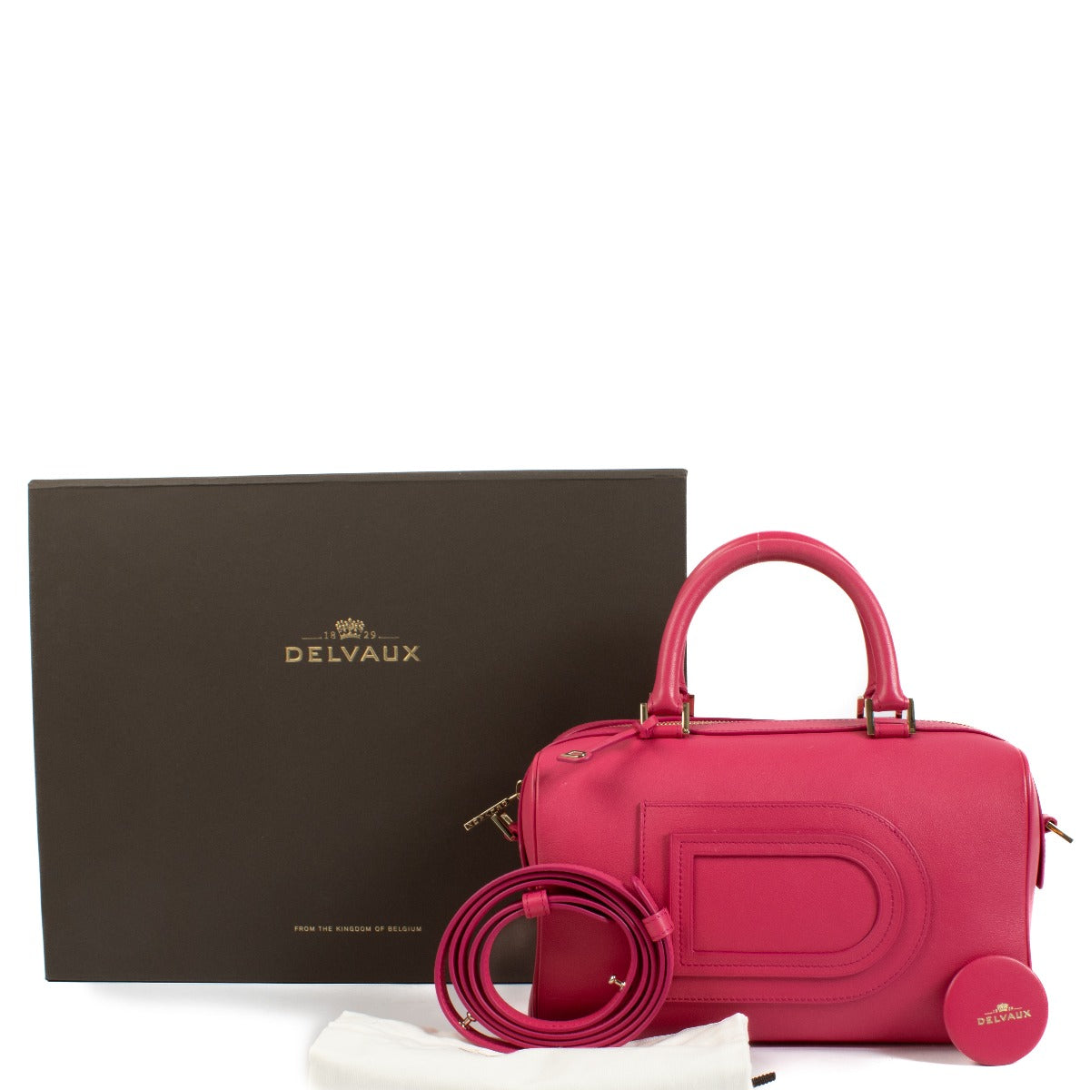 Discover the Delvaux Pink Louise Boston Top Handle Bag, a refined and structured luxury handbag crafted from premium leather. Perfect for timeless elegance and everyday sophistication. Shop now on Labellov.com.