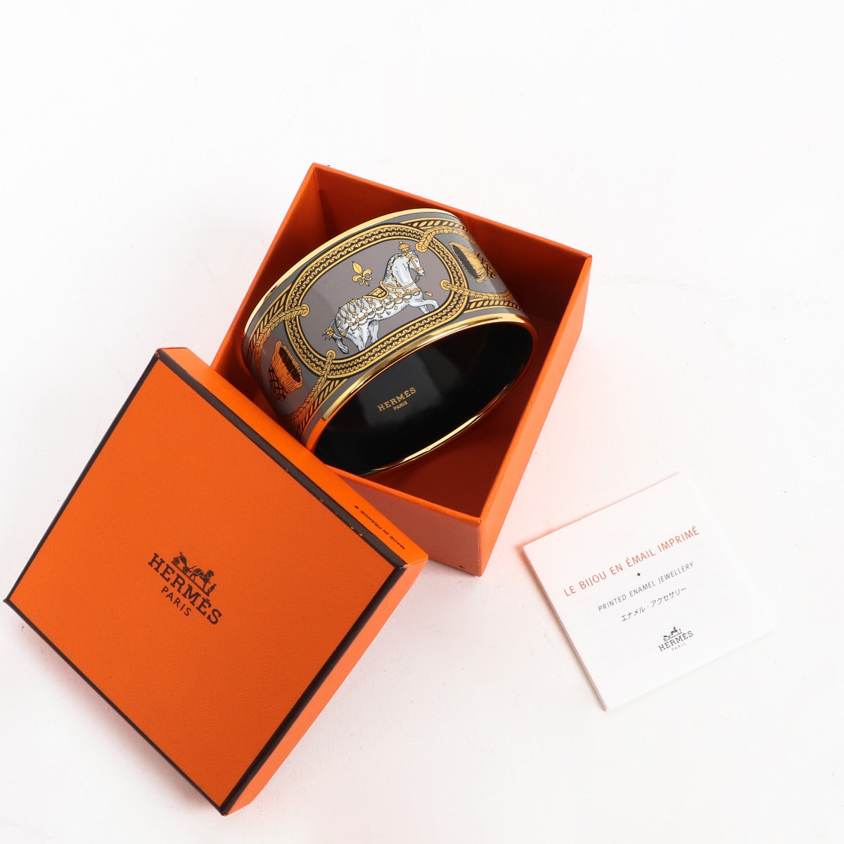 Buy an authentic Hermès Printed Enamel Bangle Bracelet Size - 70 in very good condition at Labellov in Antwerp.