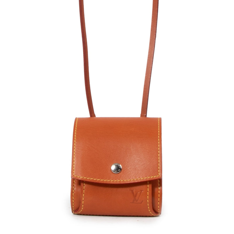 Buy a vintage authentic Louis Vuitton Camel Leather Nomade Etui Sling Case Bag in very good condition at Labellov Antwerp