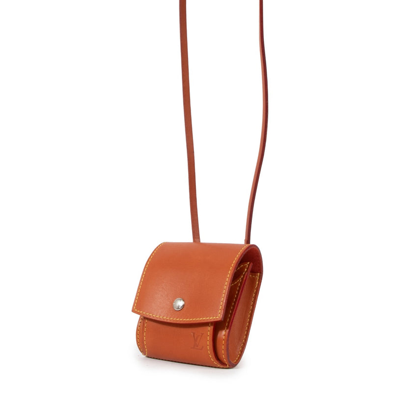 Buy a vintage authentic Louis Vuitton Camel Leather Nomade Etui Sling Case Bag in very good condition at Labellov Antwerp