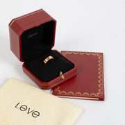 Authentic Cartier Love Ring in 18K rose gold, showing gentle wear and light scratches, complete with original box and certificate at Labellov.com.