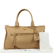 Are you looking for an authentic designer Prada Beige Calfskin Leather Bauletto Top Handle Bag? Shop and sell at Labellov.