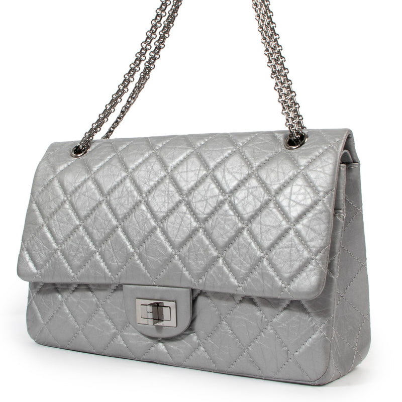Buy an aunthentic second hand Chanel Silver Aged Calfskin Leather Maxi Reissue 2.55 in very good condition at Labellov.