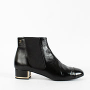 Shop safe online at Labellov in Antwerp, Brussels and KNokke these 100% authentic second hand Chanel Black Shiny Metal Heel Boots - size 38,5