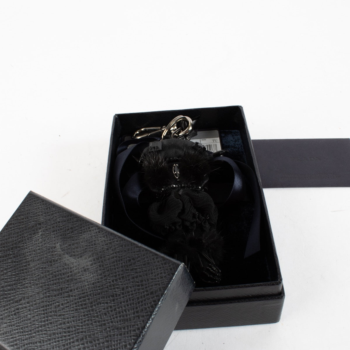 Authentic Preloved Prada Black Bag Charm on labellov.com