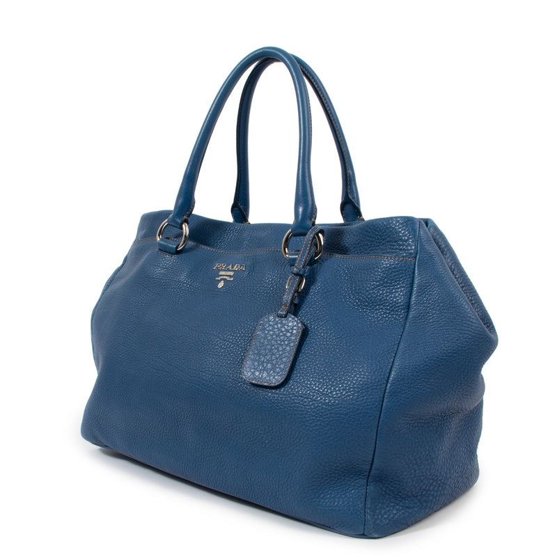 Buy an authentic second-hand Prada Blue Leather Vitello Daino Top Handle Bag in very good condition at Labellov Antwerp.