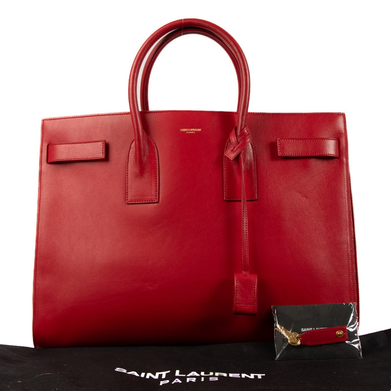 Shop safe online at Labellov in Antwerp, Brussels and Knokke this 100% authentic second hand Saint Laurent Red Large Sac de Jour Bag. Veilig online tweedehands authentieke Saint Laurent Red Large Sac de Jour handtas kopen bij Labellov.