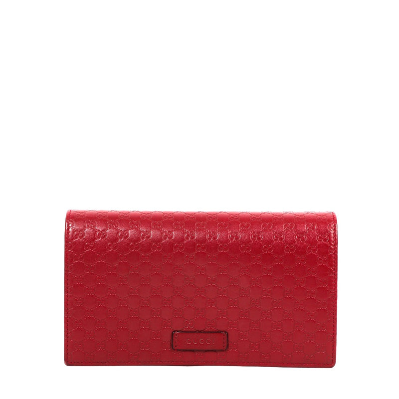 Buy an authentic second-hand Gucci Hibiscus Red Microguccissima Wallet On Strap in very good condition at Labellov in Antwerp.
