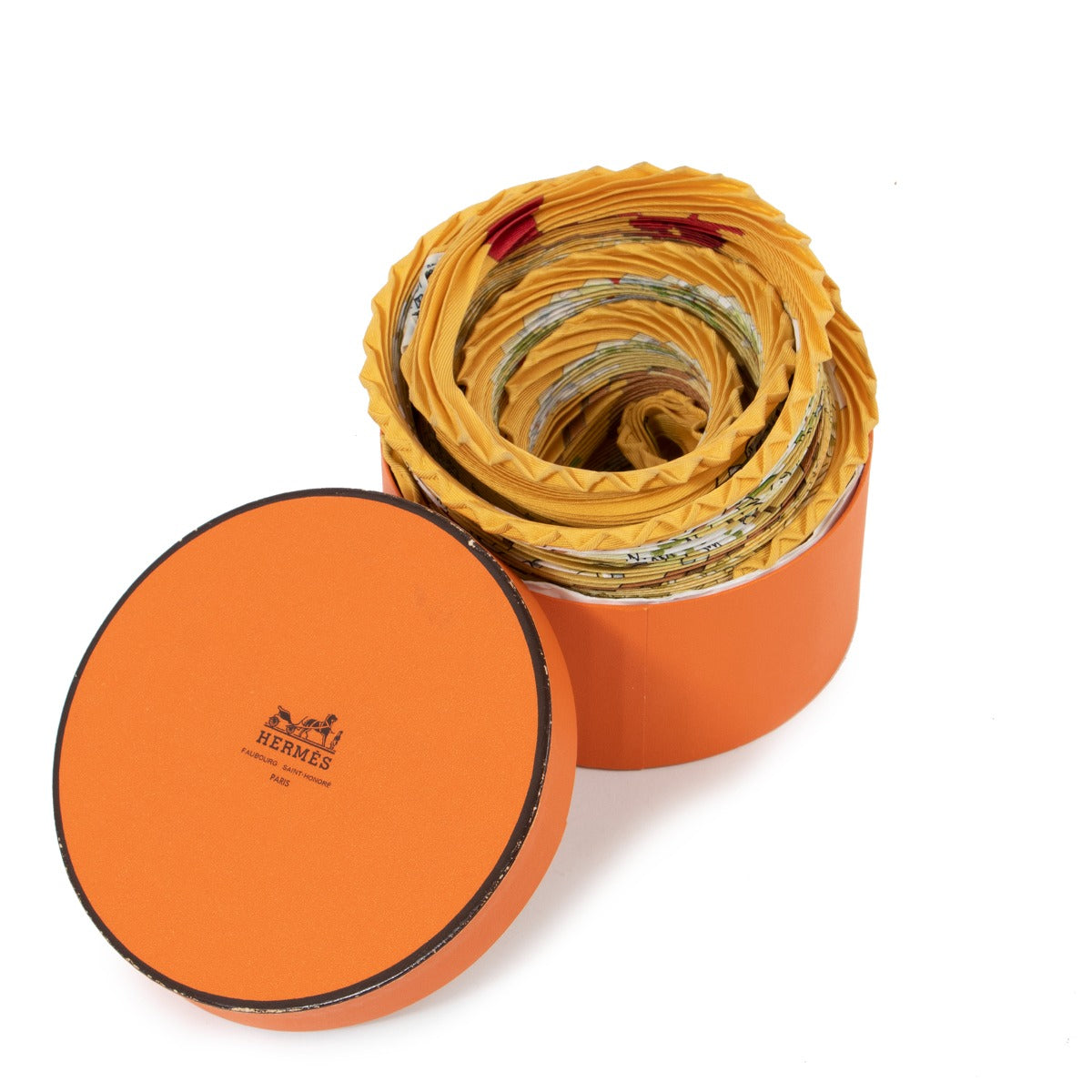 Buy an authentic second-hand Hermès Yellow Printed Silk Plisse Scarf in very good condition at Labellov Antwerp.