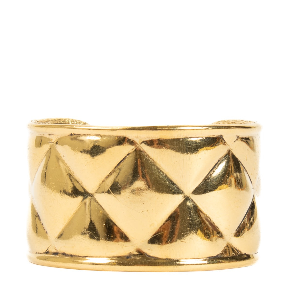 Bracelet manchette vintage Chanel matelassé doré