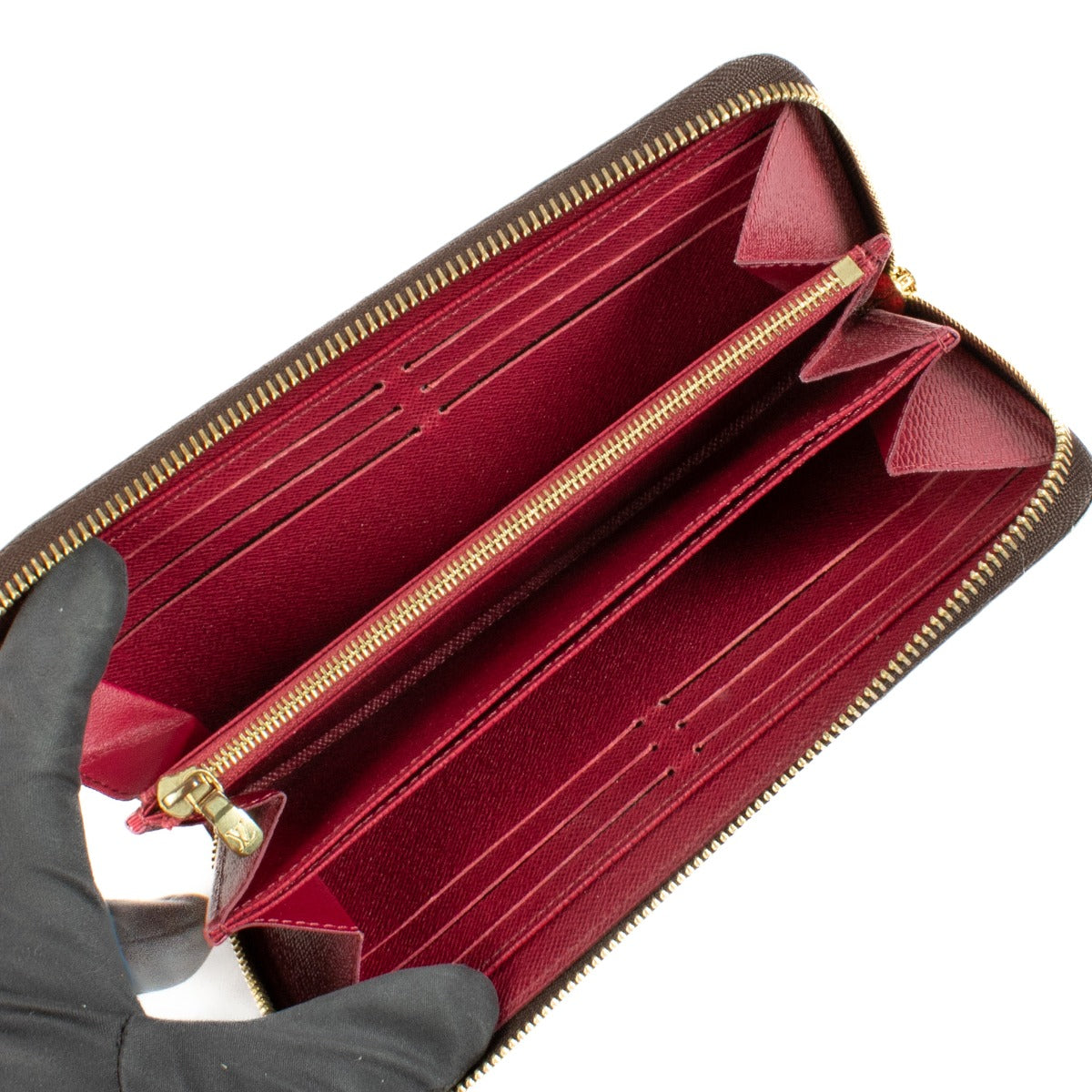Louis Vuitton Monogram Zippy Wallet featuring iconic Monogram canvas, a secure all-round zip closure, multiple card slots, a zipped coin pocket, and a spacious interior lined with grained leather. Stylish and functional for everyday use.