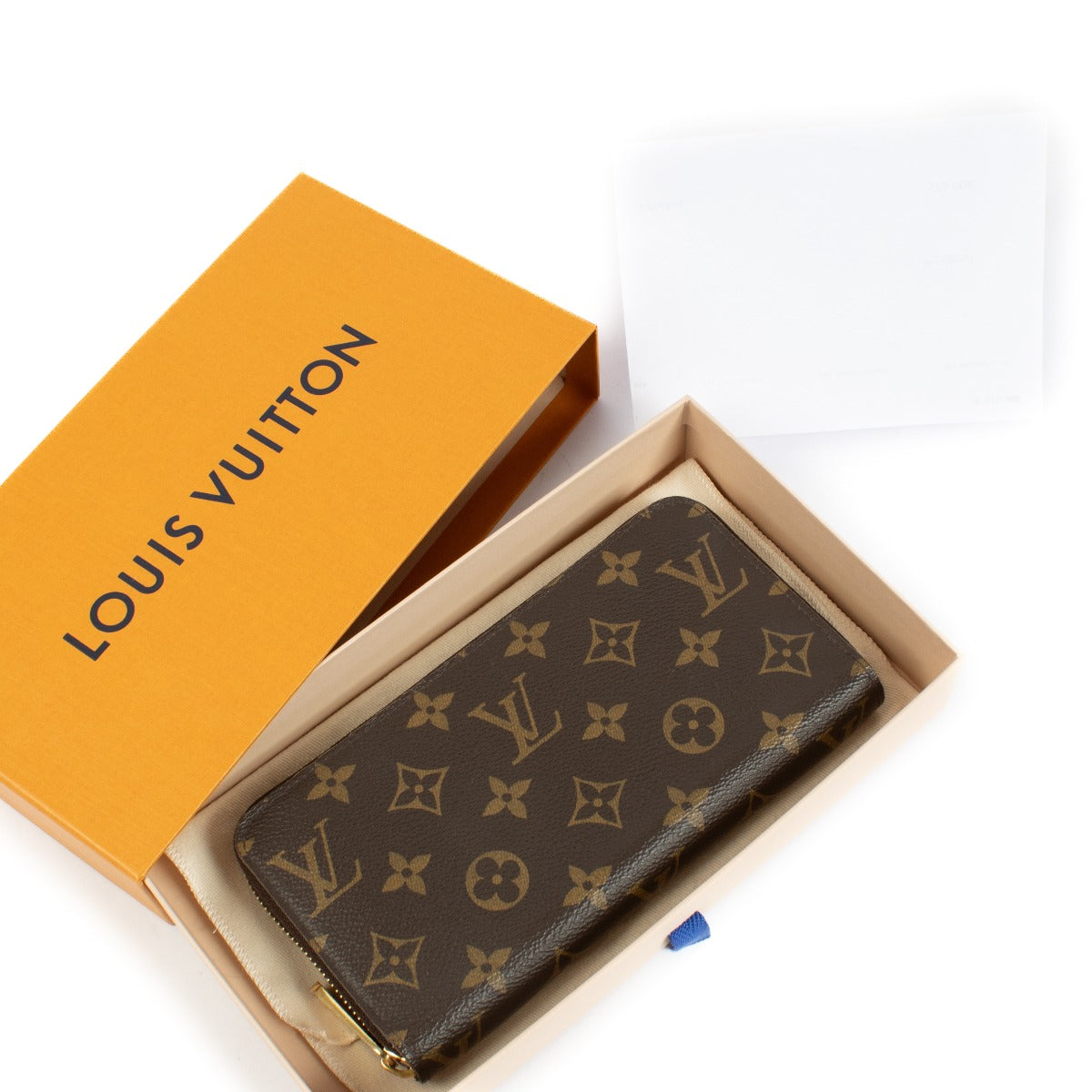 Louis Vuitton Monogram Zippy Wallet featuring iconic Monogram canvas, a secure all-round zip closure, multiple card slots, a zipped coin pocket, and a spacious interior lined with grained leather. Stylish and functional for everyday use.