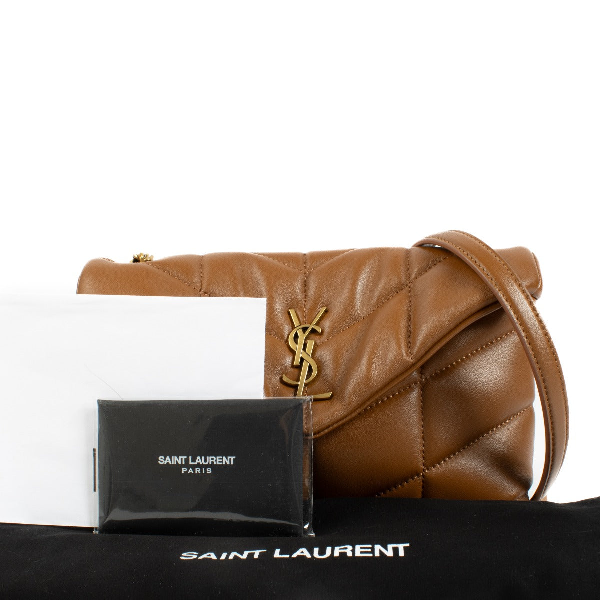 Mini version of the Loulou Puffer in soft nappa lambskin, featuring chevron quilting and a sliding chain strap for shoulder or crossbody wear. Buy now on Labellov.com.
