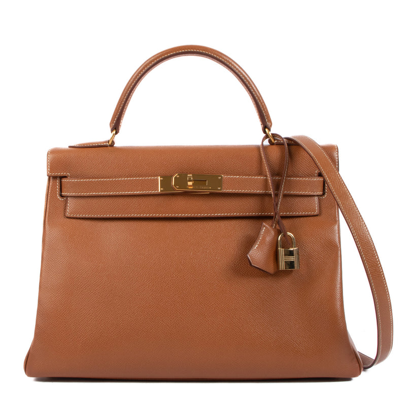 Hermès Kelly 32 Gold Courchevel GHW for the best price at Labellov secondhandn luxury in Antwerp. We buy and sell your preloved and brand new designer bags.