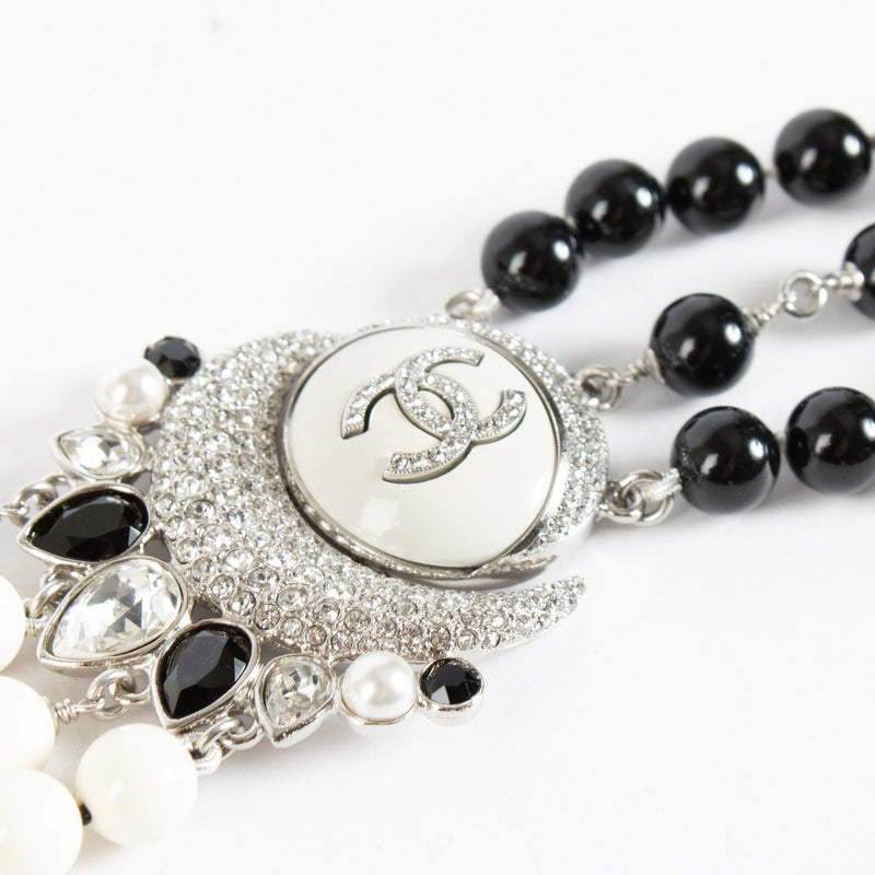 Chanel 22C CC Moon Bracelet with black and white beads at Labellov.com