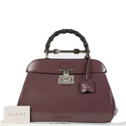 Shop safe online at Labellov in Antwerp, Brussels and Knokke this 100% authentic second hand Gucci Purple Leather Lady Lock Bamboo Top Handle Bag